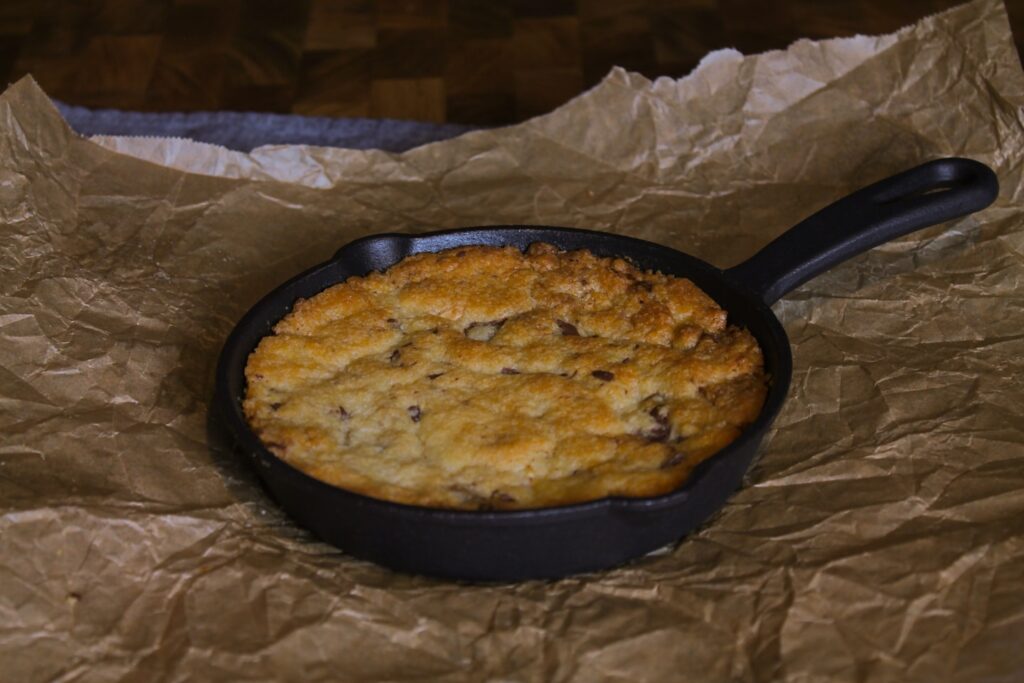 A skillet of food sitting on top of a piece of paper